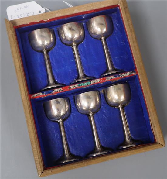 An early 20th century boxed set of six Chinese Export white metal liqueur goblets, maker probably Sing Fat, 83mm.